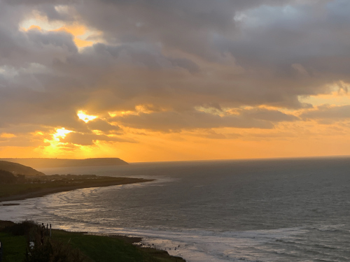 Sun setting on incoming tide